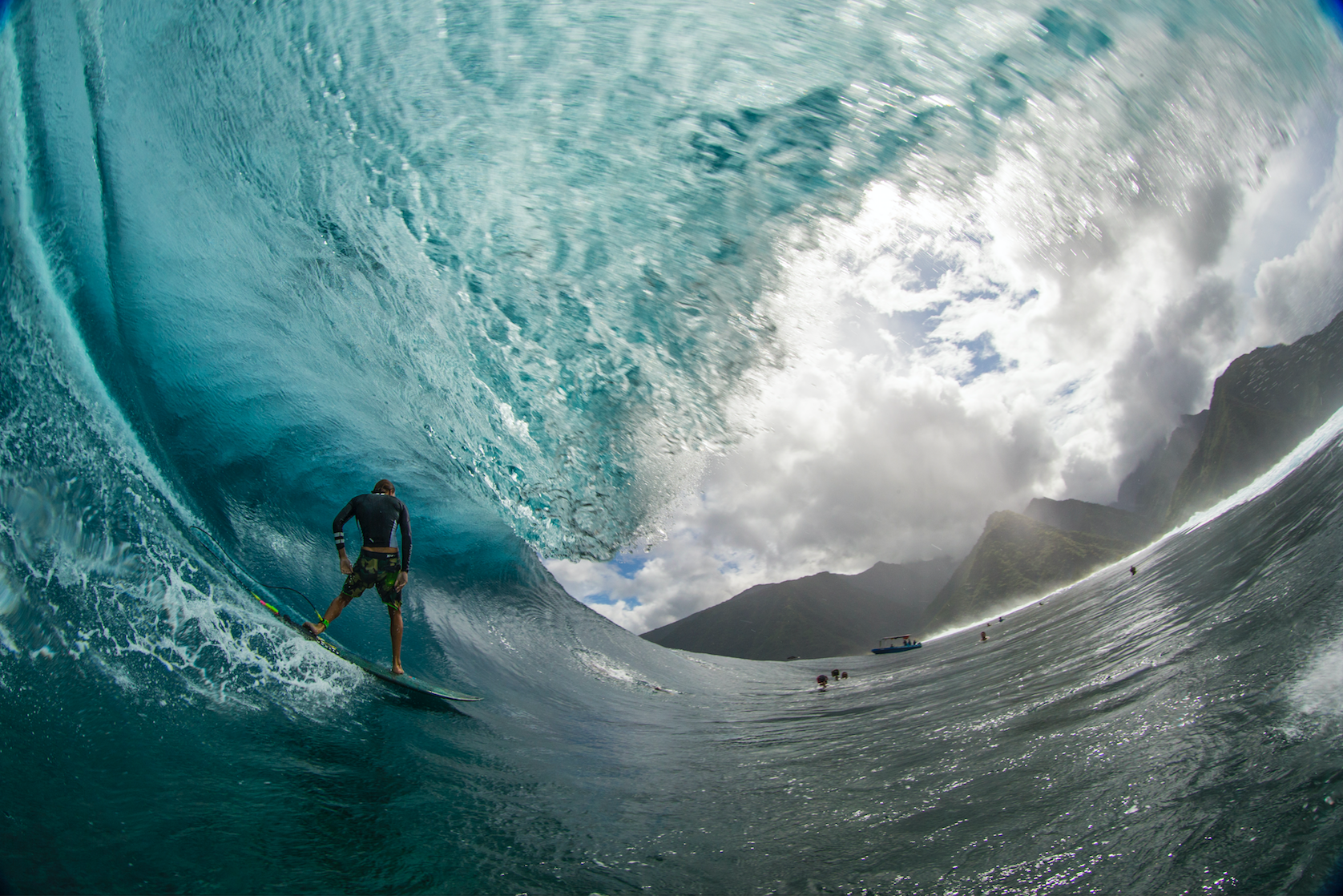 Surfer gets barreled in Tahiti from water angle. Photo: Zak Noyle